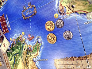 Great shot of the art for the coins. The final version of the tokens will have jagged edges.